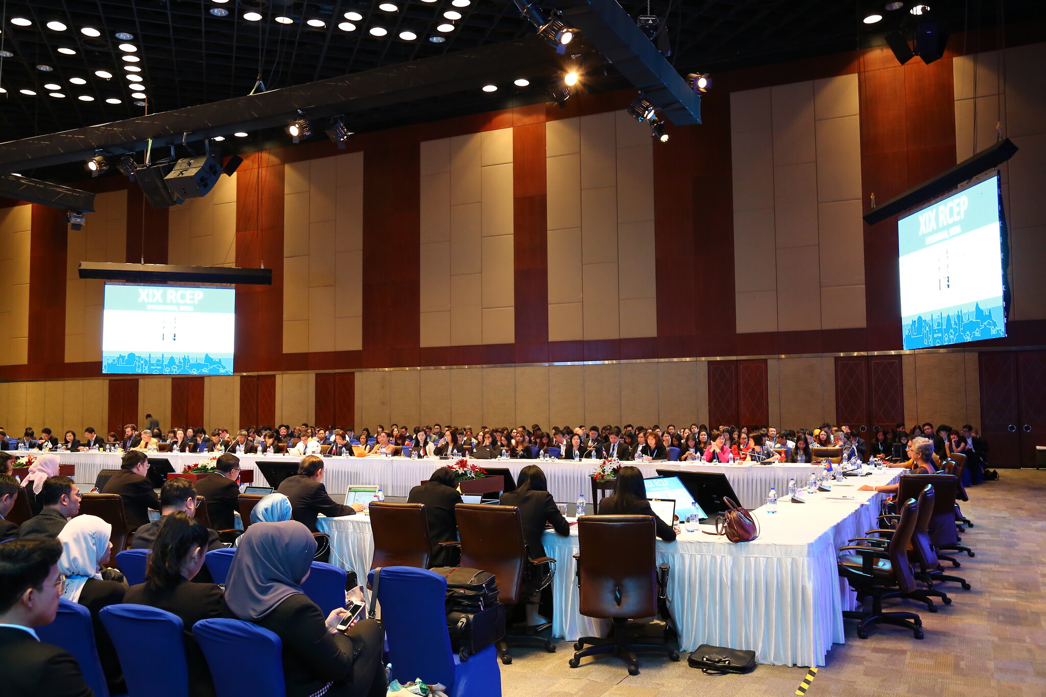 "Premium corporate conference setup in Hyderabad with AV screens and executive seating" 